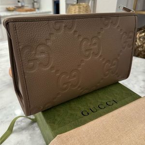 Rare hard to find.Gucci Jumbo GG Brown Clutch Bag
